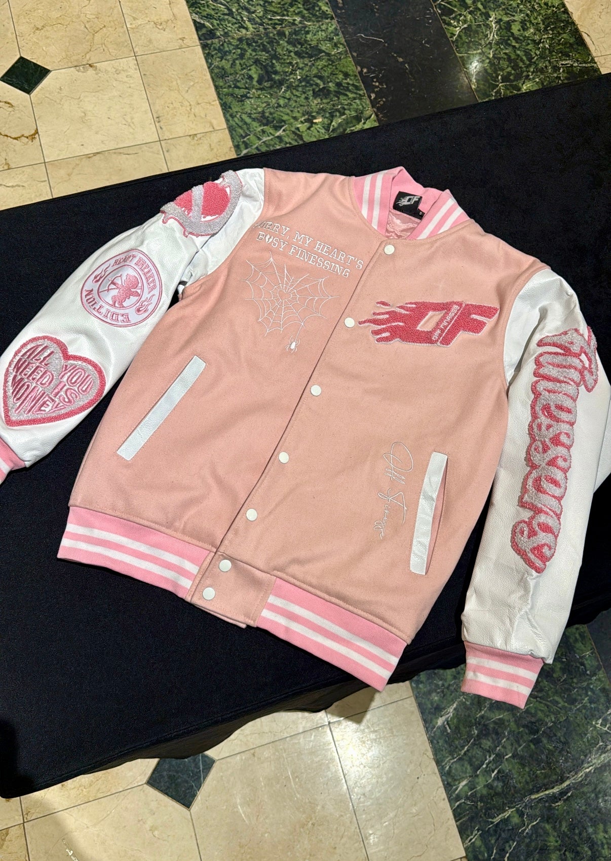Pink heartbreak bomber
